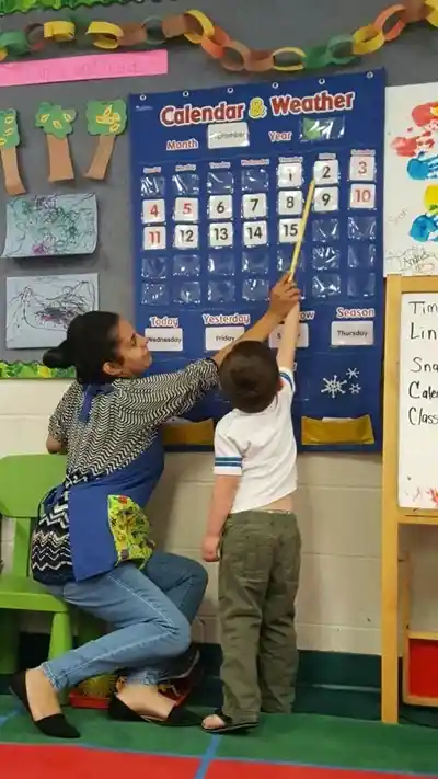 Teacher teaching her student
