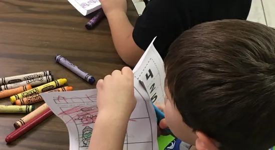 Boy Cutting a paper